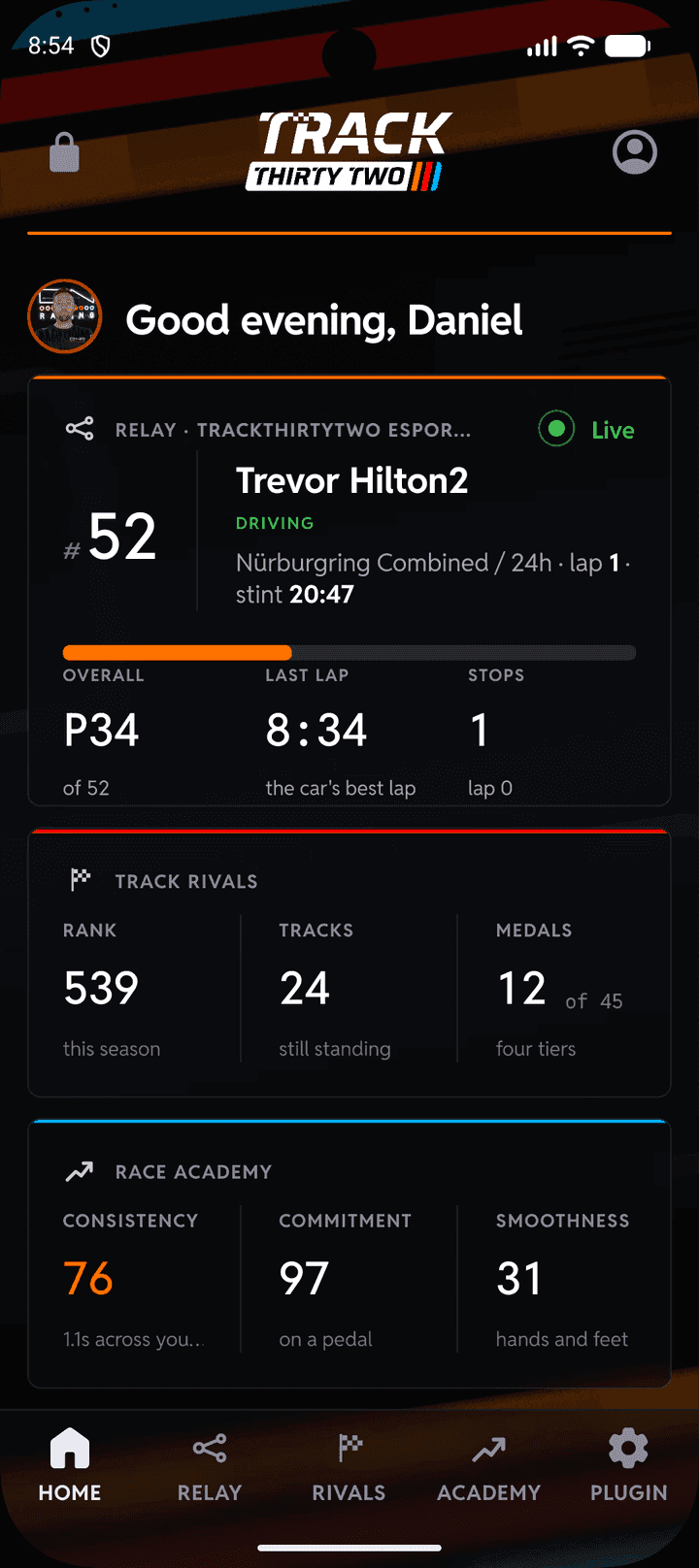 The TrackThirtyTwo app on a phone: the Home page with a teammate driving on the Relay tile beside the Track Rivals and Race Academy tiles